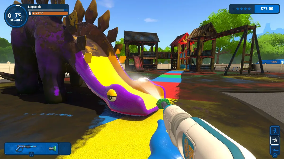 Cleaning a colorful dinosaur slide with a power washer in PowerWash Simulator