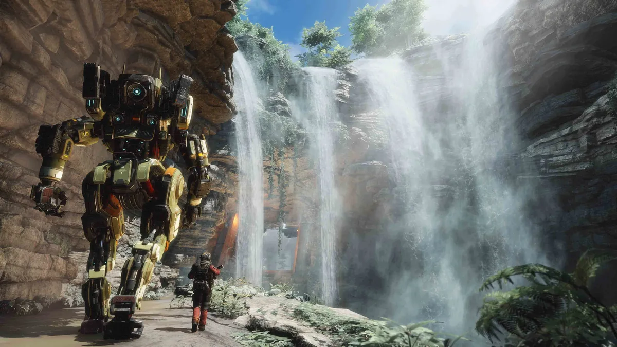 Pilot Jack Cooper walking beside the Titan BT-7274 through a canyon in Titanfall 2