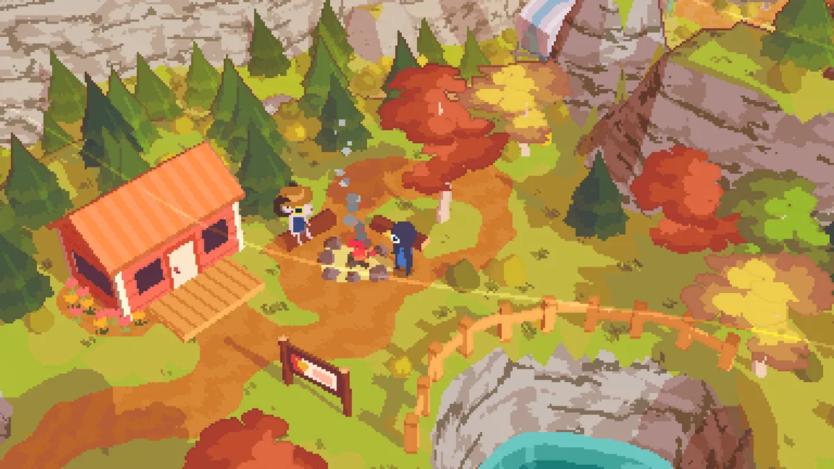 Claire standing with two other hikers beside a campfire in A Short Hike